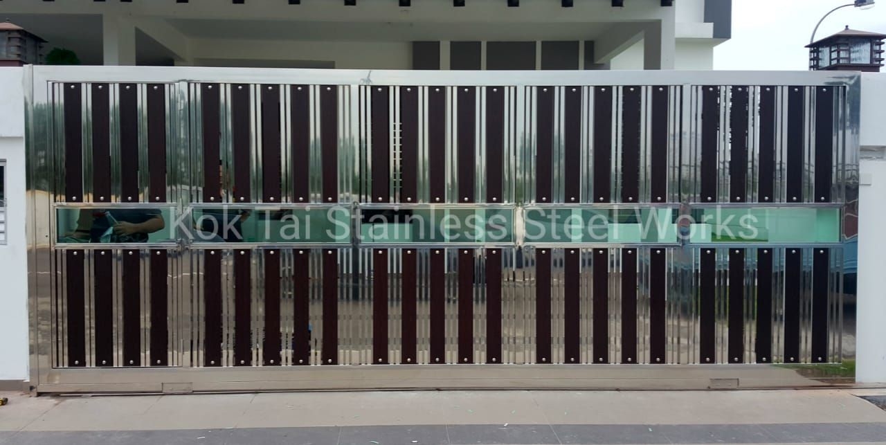 Wide stainless steel sliding gate with glass band
